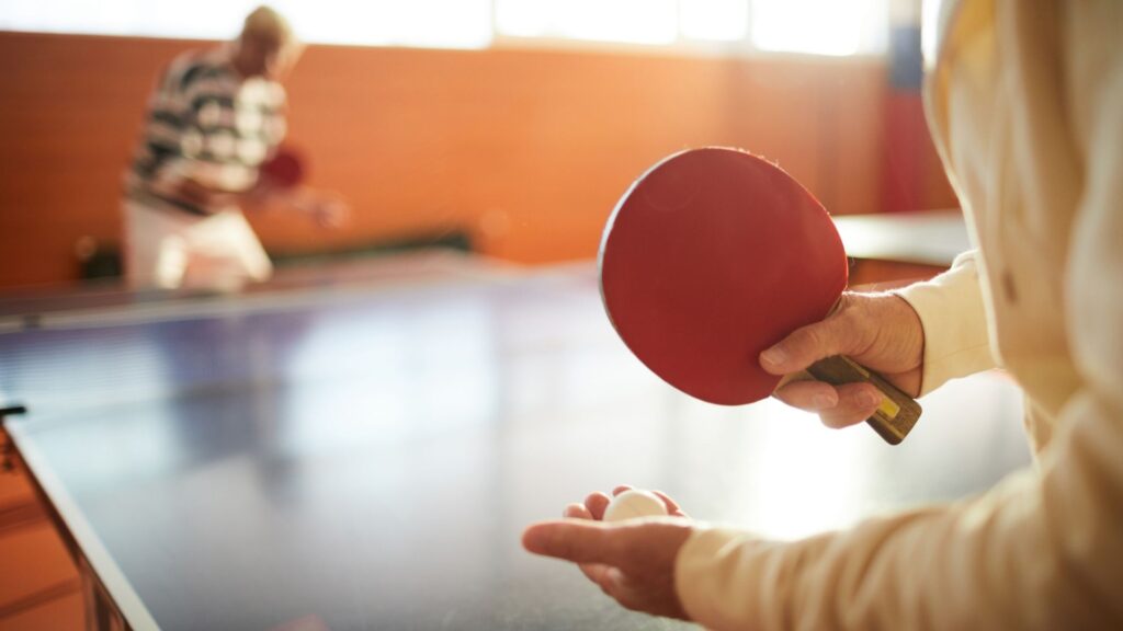 Picture of player using a stiga pro carbon paddle to play ping pong.