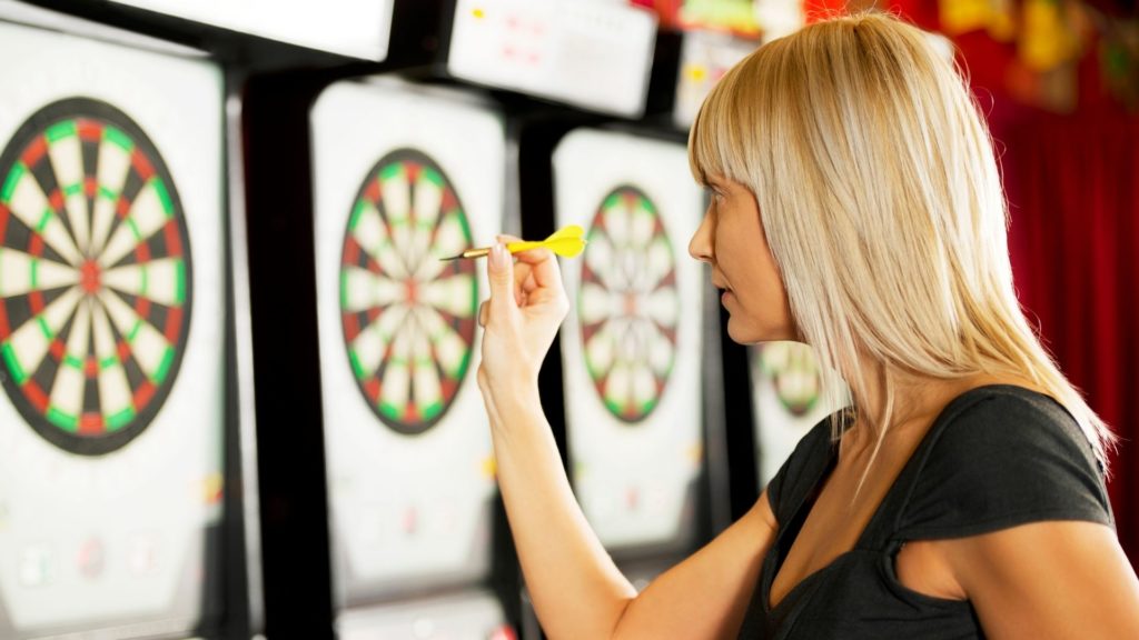 Picture of a person playing darts.