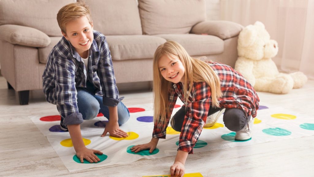 Picture of kids playing twister games during family game night.