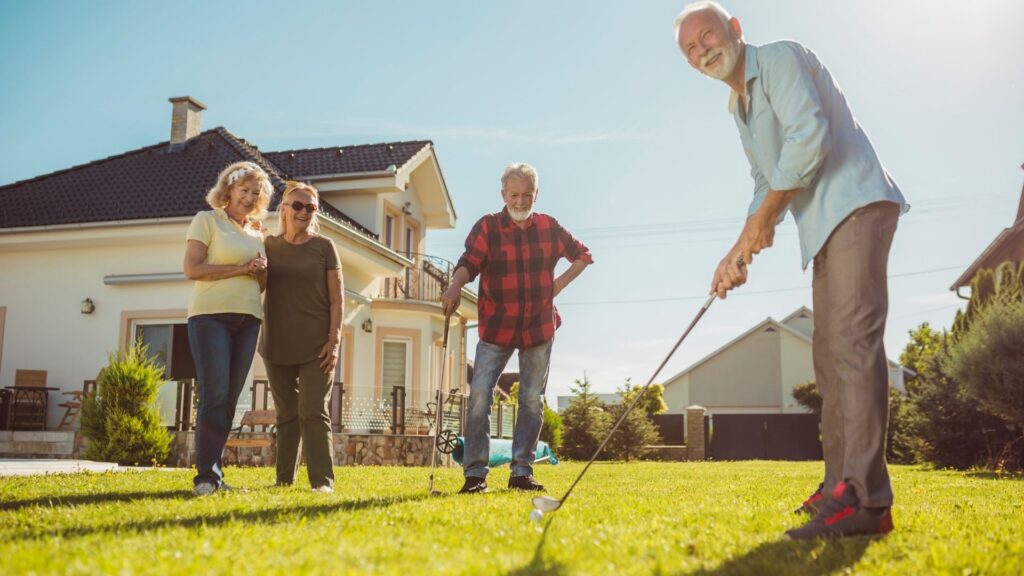 Picture of a family playing backyard golf.