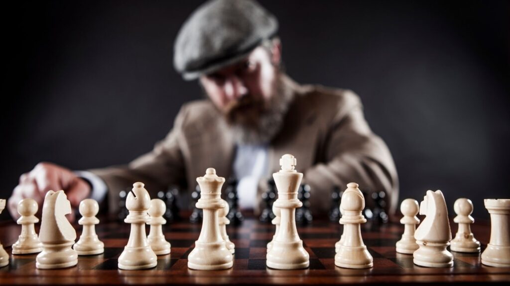 Picture of a man playing a chess game.